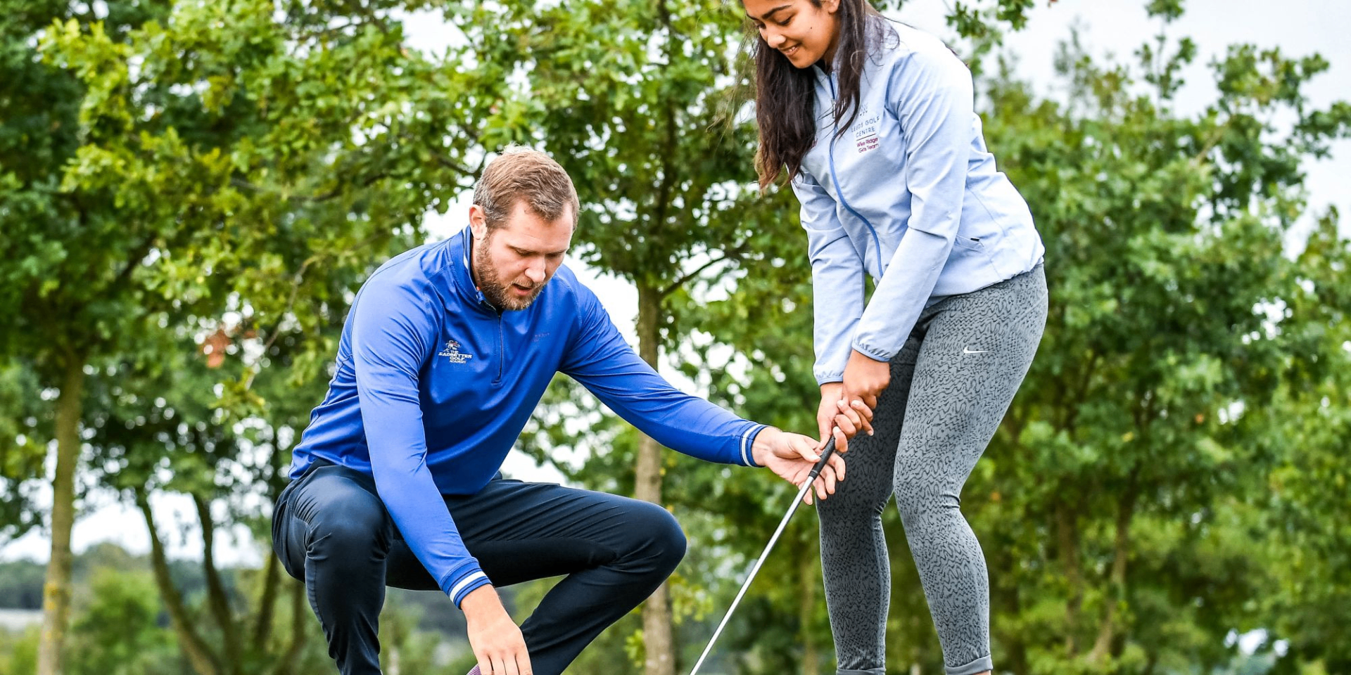 PGA golf coach giving a lesson to a student on a UK golf course